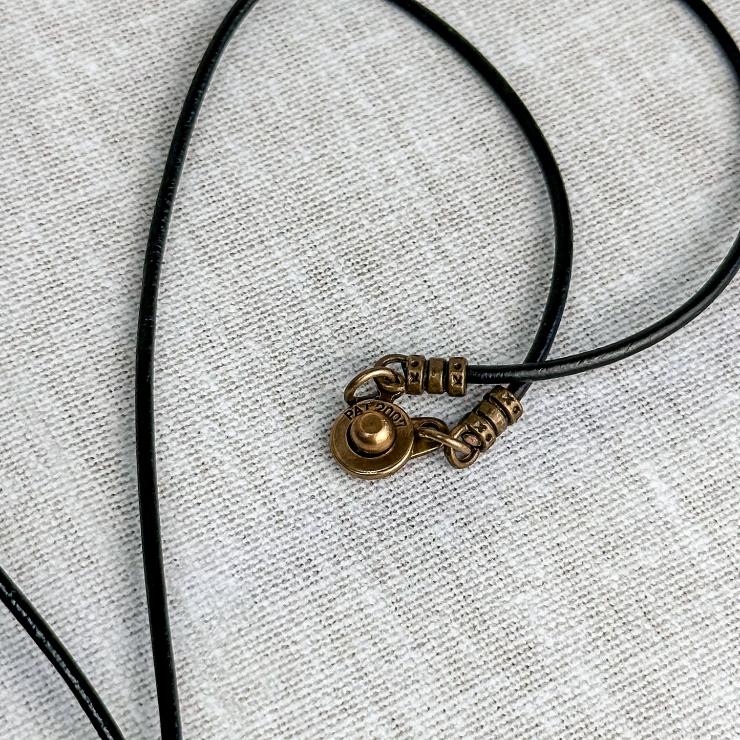 Leather Cord Pendant Necklace: Modern Hammered Silver Focal