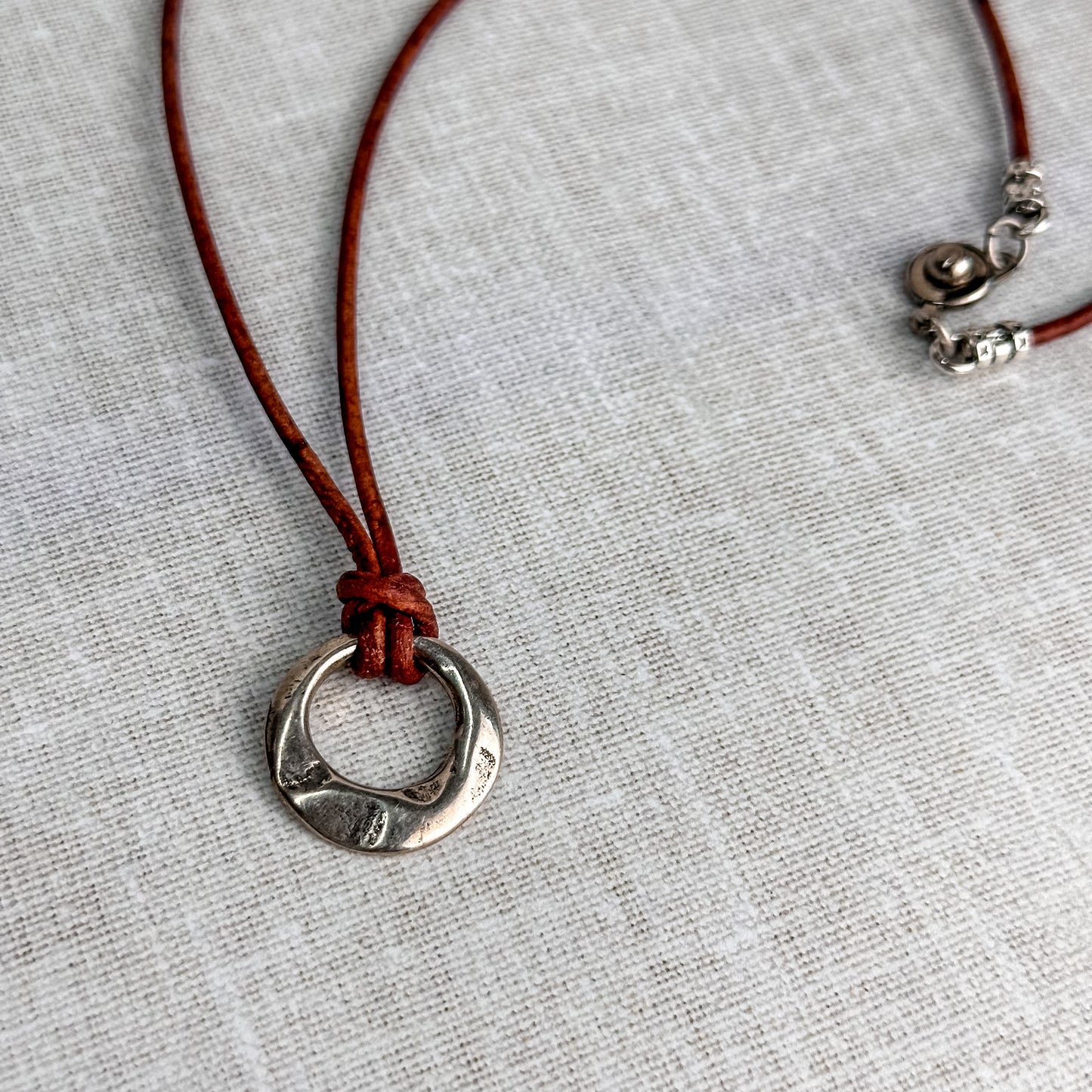 Leather Cord Pendant Necklace: Modern Hammered Silver Focal